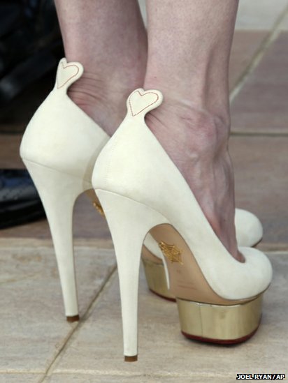 Kirsten Dunst ivory Charlotte Olympia “Dolores” pumps 